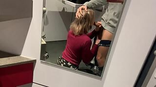 This blonde met her old friend in a mall who used to have a crush on her. She followed him to the toilet where she sucks his cock after which he fucked her.